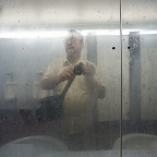 Self portrait through mirror, Block Island public lavatory ©IL 2011 / photo ID #00075